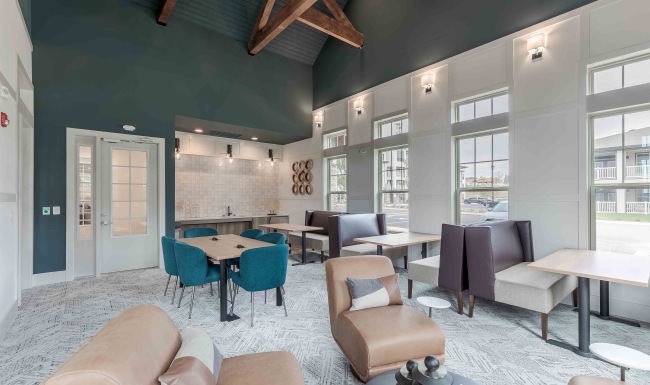 a room with booth seating and tables