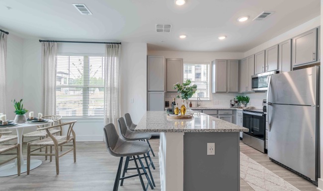 a kitchen island with stools