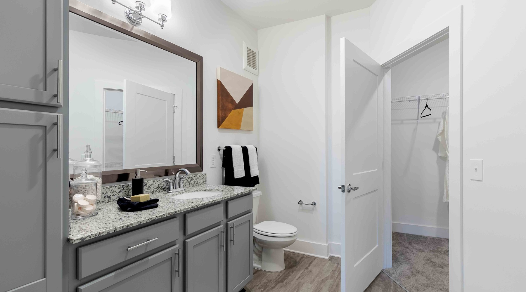 Spacious bathrooms with everything you need a bathroom with a sink toilet and closet